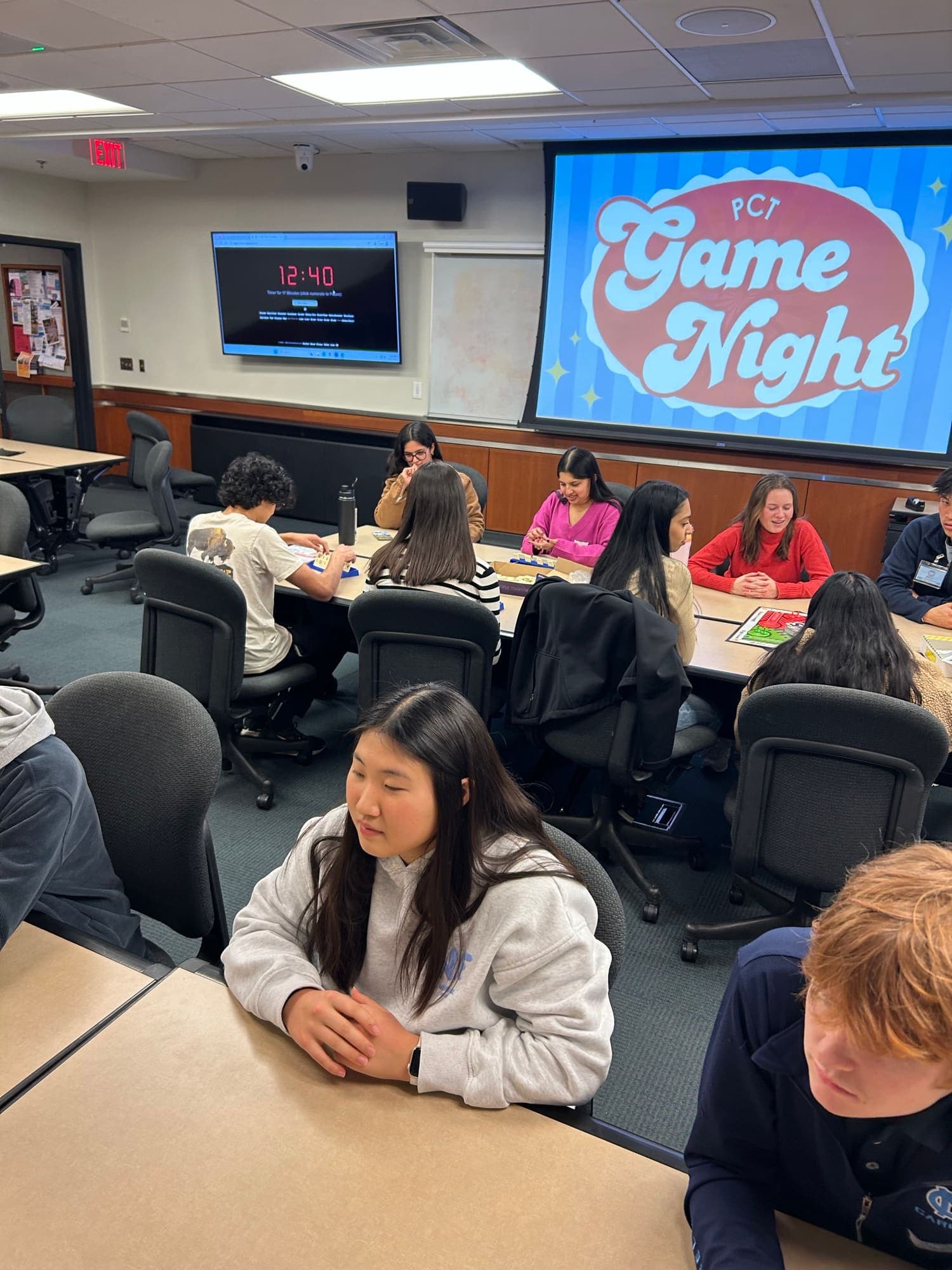 Students and members at a Phi Chi Theta recruitment game night