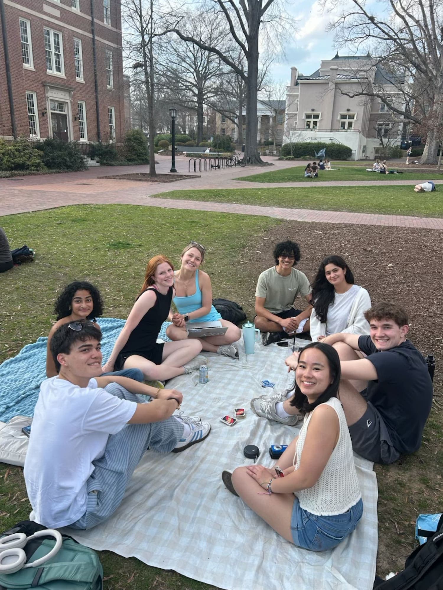 Eta Theta members sitting together on the quad at UNC Chapel Hill