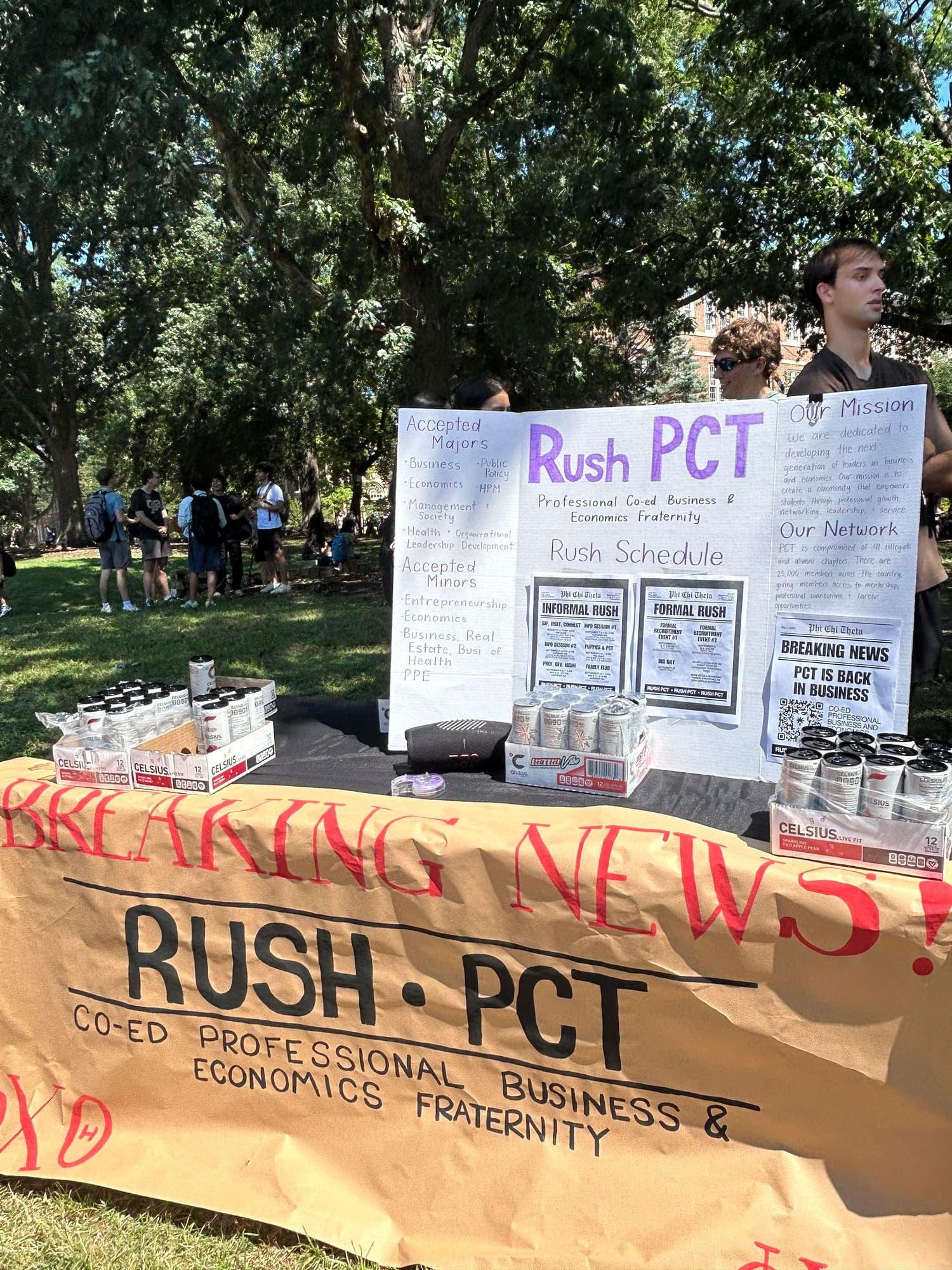 The Back in Business Rush banner hanging from a table on the Quad